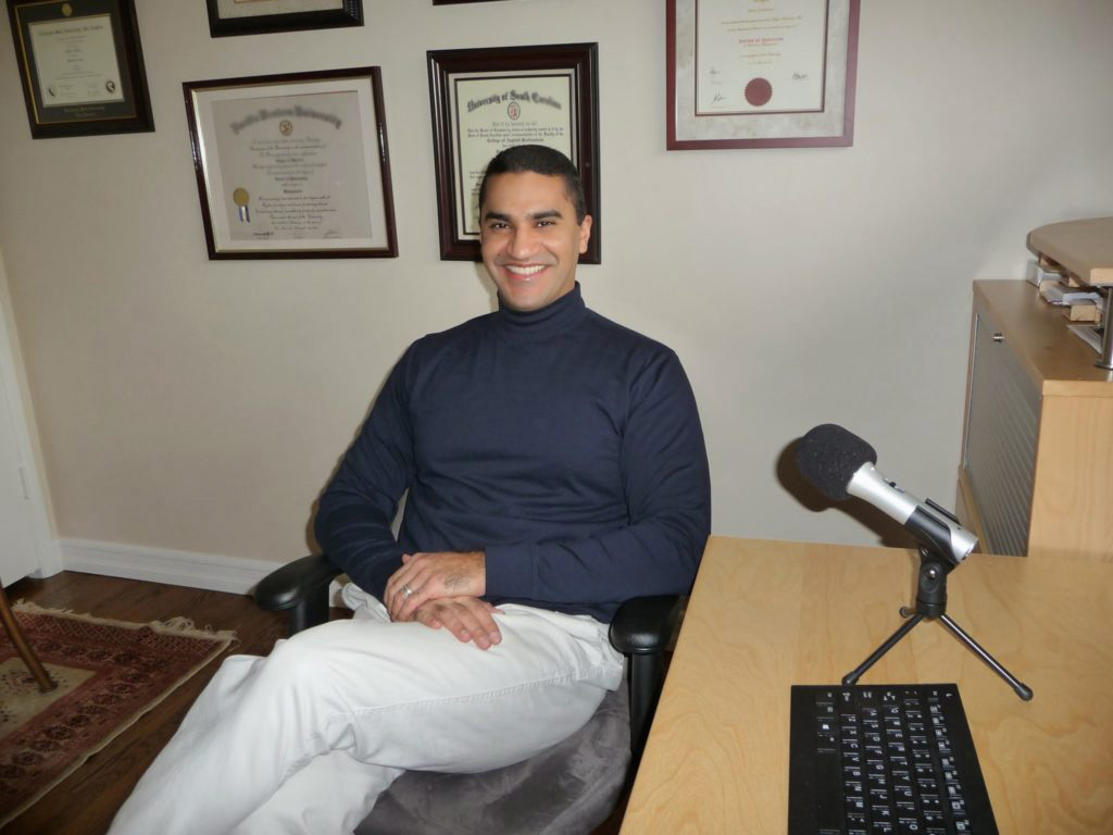 Photo of Dr. Fawaz Al-Malood podcasting